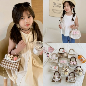 Variety of kids houndstooth bucket bags with pearl handles and cute plush charms