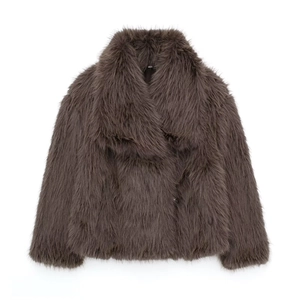 Detailed close-up of dark brown faux fur texture and long plush fibers on women jacket