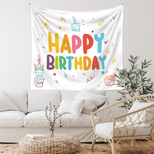 Detail of white Happy Birthday tapestry with colorful hand-drawn stars and cake patterns