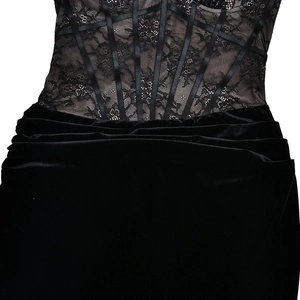 Detail of black lace corset dress with floral patterns and satin boning over velvet