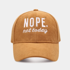 Detail of NOPE embroidery on high-quality suede baseball cap with a curved brim