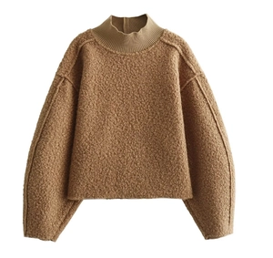 Detail of coffee brown textured sherpa pullover with ribbed half-neck and warm fleece fabric
