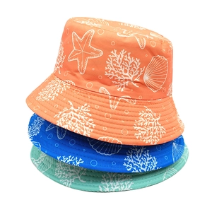Reversible bucket hats with starfish and coral prints in orange, blue and green
