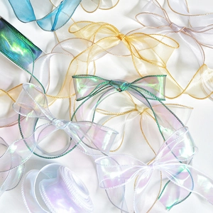 Iridescent organza ribbon bows with metallic edges in champagne and pearl white tones