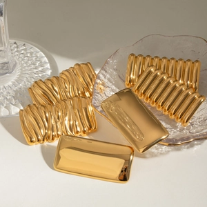 Golden geometric stainless steel earrings set with smooth and textured rectangular patterns