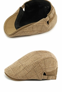 Detail of wool blend plaid flat cap showing inner lining, 30% wool tag and side metal buckle