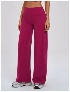 Detail of high-waist yoga wide-leg pants in deep rose red with premium drape texture