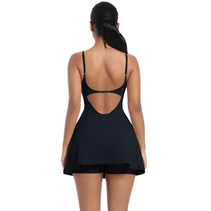 Detail of a black tennis dress featuring a large heart-shaped cut-out design on the back