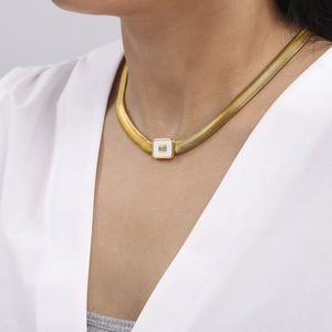Gold-plated snake chain necklace with square white enamel pendant and sparkling crystal