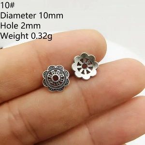 Macro shot of 10mm silver flower petal bead caps for DIY jewelry making and beading