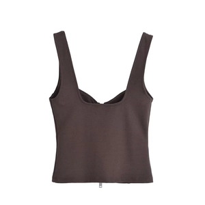 Detail of chocolate brown sleeveless crop top featuring a central metal zipper design