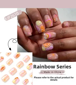 Rainbow Series press-on nails detail with colorful waves, heart, and smiley face motifs