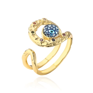 Detailed macro view of bohemian evil eye open ring with colorful crystal accents