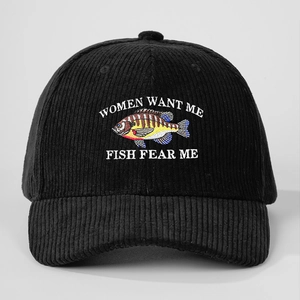 Close-up of Women Want Me Fish Fear Me embroidery on black corduroy baseball cap