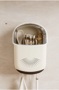 Detail showing wall-mounted white chopsticks storage box with a transparent lid and hooks