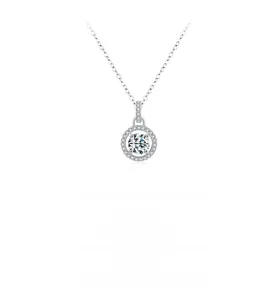 Macro detail of a sparkling round moissanite pendant on a silver box chain necklace