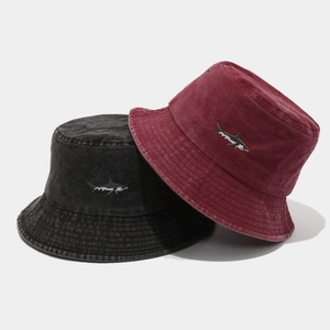 Unisex washed cotton bucket hat featuring embroidered shark detail in black and wine red