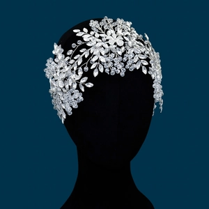 Detailed view of silver bridal headband with intricate crystal flowers and rhinestones