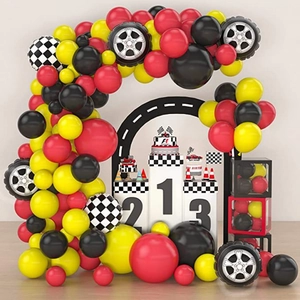 Racing car themed party set with checkered flags, podium and tire balloons for birthday decor