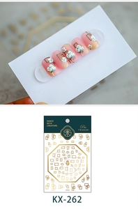 Detailed pink gradient nail stickers with gold geometric patterns and white 3D floral accents