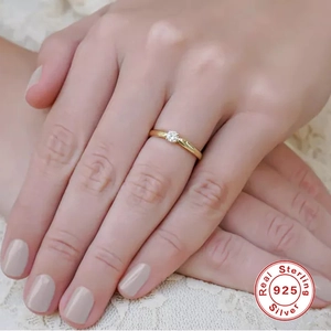 Classic S925 sterling silver solitaire ring with round cubic zirconia on a gold band
