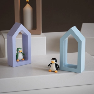 Minimalist hollow house frames with cute penguin figurines for home desk decor