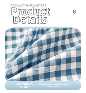 Macro shot of blue and white plaid pillowcase fabric with soft woven texture detail