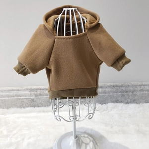 Close-up of brown pet hoodie showing ribbed elastic cuffs and soft knit fleece fabric