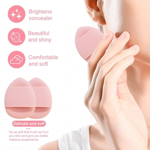 Detailed view of soft pink makeup sponges showing delicate texture and skin application