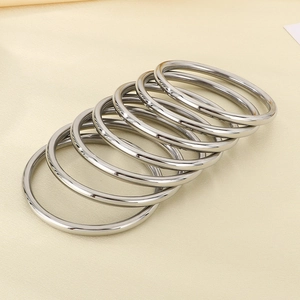Detailed view of polished silver metal rings set for DIY accessories and hardware