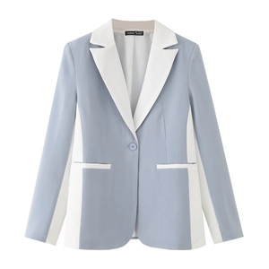 Detail of blue and white patchwork blazer with flat notched lapel and single button closure