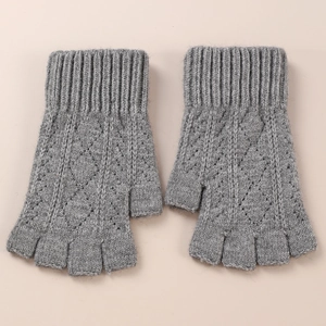 Close-up of grey knitted fingerless arm sleeves featuring diamond hollow-out pattern
