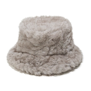 Macro detail view of a grey faux fur plush bucket hat designed for winter warmth and comfort