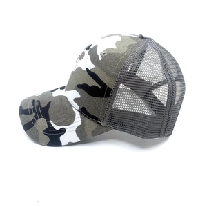 Detail view of breathable woodland camouflage mesh trucker hat for outdoor sun protection