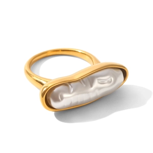 Detailed close-up of a baroque pearl inlay on a polished 18K gold plated stainless steel ring