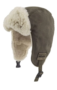 Detail of army green trapper hat with warm faux fur lining and vintage leather patch