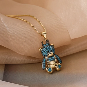 18K gold plated necklace with a crown teddy bear pendant and blue zircons on silk