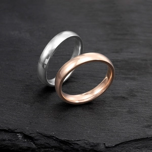 Minimalist 4mm polished stainless steel rings in silver and rose gold finishes