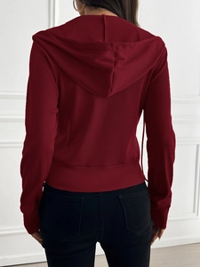 Back view of a red ribbed knit cropped hoodie showing the textured hood and hem detail