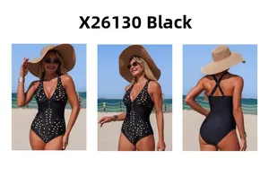 Deep V-neck black one-piece swimsuit featuring laser-cut floral details and cross-back straps
