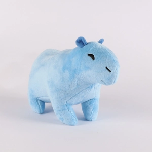 Close-up of soft light blue capybara plush toy with detailed fur texture on white background