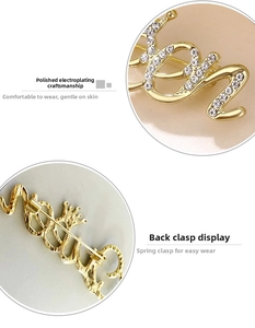 Detail of polished gold Queen brooch with rhinestones and back buckle view