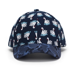 Detail of navy blue baseball cap featuring white swan prints and camouflage brim pattern