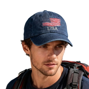Vintage navy washed denim baseball cap featuring American flag embroidery on white background