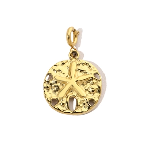 Detailed macro view of a gold sand dollar and starfish pendant with hammered texture