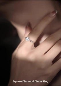 Detail view of square cut diamond chain ring featuring sparkling silver finish for women