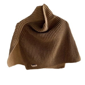 Brown knit turtleneck neck warmer with vertical rib texture and small white logo label
