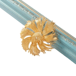 Golden French vintage floral tassel brooch in a fireworks design for women coats