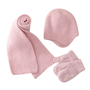 Pink winter knit set for babies featuring a warm beanie hat with scarf and gloves