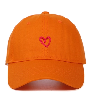 Detailed embroidery of a red heart on the front of an orange cotton baseball cap